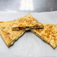 68. Chicken Quesadilla · Lemon grilled chicken, white onion, red and green pepper, melted cheddar and mozzarella.