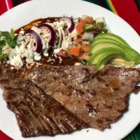 Bistec a la Tampiquena · Steak Tampiquena style served with rice and beans, and tortillas or bread.
