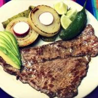 Bistec Oaxaca · Steak oaxaca style served with rice and beans, and tortillas or bread.