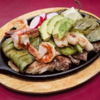 Parrillada el Mariachi · House special Grilled Meats (Fish fillet, Steak, Pork Chop & Shrimp) on top of fresh avocado...