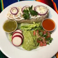 El Mariachi Burrito · House special. Flour tortilla stuffed with rice, beans, & your choice of meat served with si...
