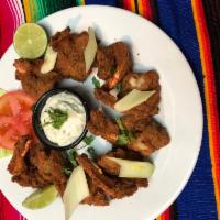 Camarones Empanizados · Breaded shrimp served with rice and beans, and tortillas or bread.