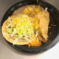 #1. Bean Tostada and Beef Taco Combo · Bean tostada (lettuce and cheese), Shredded chicken crispy taco (lettuce and cheese). Rice a...