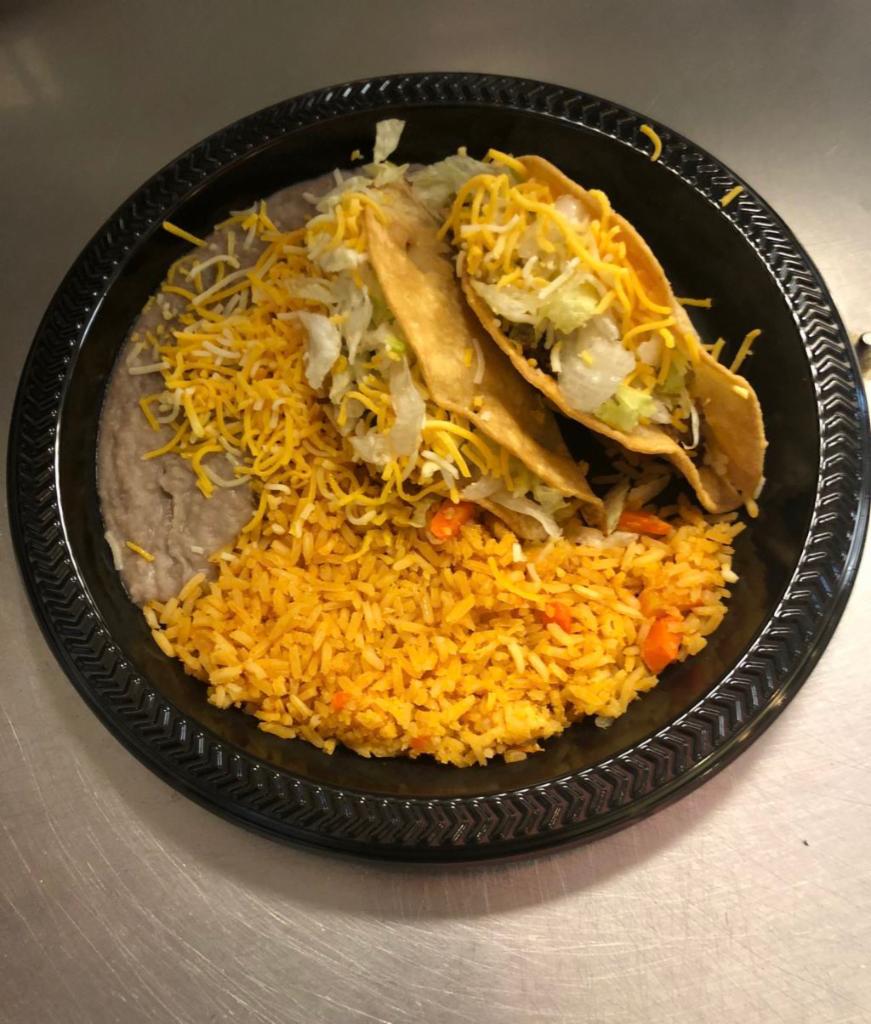 #2. Two Beef Tacos Combo · Two crispy tacos choice of beef, shredded or ground beef (lettuce and cheese). Rice and beans with cheese on the side.