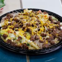 Carne Asada Fries · French fries with steak, pico de gallo, guacamole, sour cream, cheese and beans.