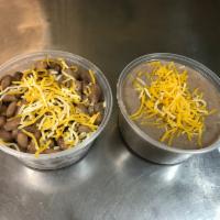 Half Pint Beans · 12 oz cup pinto beans. Your choice of refried or whole pinto beans with cheese on top.