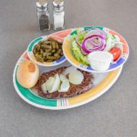 Hamburger Steak Platter · Grilled onions on the steak with 2 sides and a roll