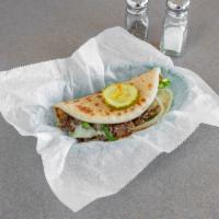 Philly Cheese Steak Sandwich · Grilled onions, grilled peppers, and Swiss cheese on pita.