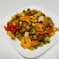 Kung Pao Combo · Shrimp, beef, chicken with water chestnuts, celery, onion, peas, carrots and peanuts stir fr...