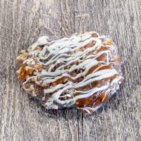 Dipped Pretzel -Pecan Delight · Traditional twist pretzel dipped in gourmet milk chocolate with 1/2 -covered with fresh peca...