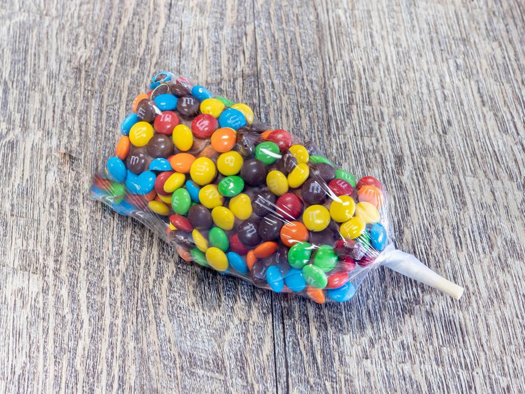 Dipped Marshmallows -M&M · 3 large fluffy marshmallows on a stick dipped in milk chocolate and topped with mini M&M's candies