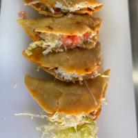 Empanadas · Lettuce, tomato, cheese & sour cream.