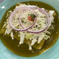 Enchiladas · Rolled soft corn tortillas choice of chicken, beef or cheese in spicy red or green sauce.