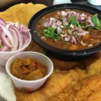 Chole Bhature · Spiced white chickpeas made semi gravy with a fried bread(bhature).
