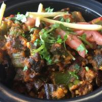 Bhindi Masala · Bombay Dhabba style okra cooked with onions, tomatoes, & peppers.