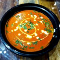 Chicken Tikka Masala · Flavorful rich tomato sauce cooked with a blend of exotic spices.