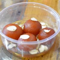 Gulab Jamun · Milk based balls dipped in rose & honey syrup