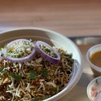 Biryani · Delicious blend of spices and basmati rice. Served with Raita and curry sauce and garnished ...