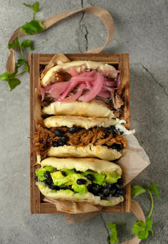 La Rumbera- Gluten Free · This arepa is made from handmade gluten free dough, stuffed with mozzarella cheese, shredded roast pork and pickled onions. 