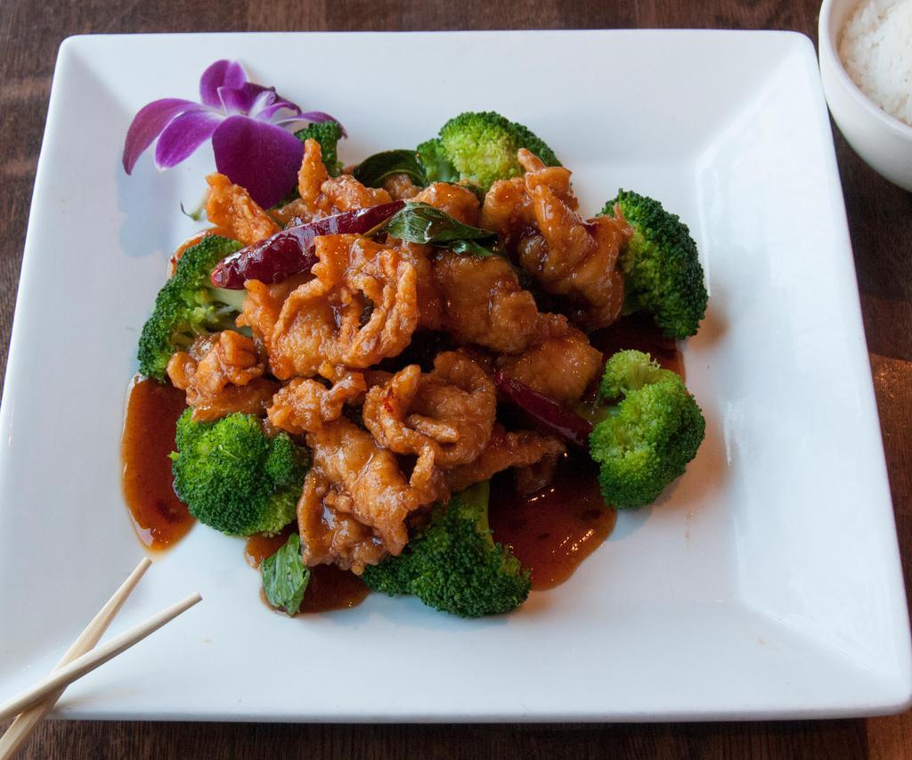 5 Flavor Chicken · Marinated with 5 different spices with carrot and greens sauteed in a light sweet and sour ginger basil sauce. Hot and spicy.