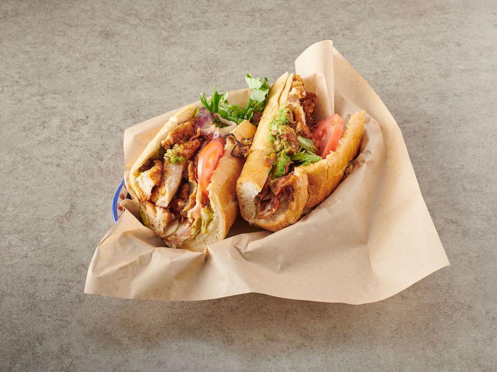 73. Maximo Sandwich · Chicken cutlet, fresh mozzarella, bacon, avocado, lettuce, tomato, onion and mayo. Served on hero bread. 