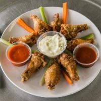 Fresh Buffalo Wings · Bleu cheese, celery sticks and your choice of hot or mild sauce.