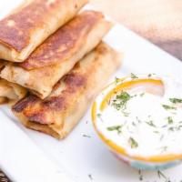 Savory Crepe · Stuffed with meat, topped with sour cream and dill.