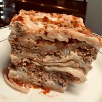 Lasagna · Fresh lasagna noodles stuffed with fresh ricotta, mozzarella and seasoned beef in homemade m...