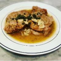 Veal Piccata · Veal sautéed in lemon, capers, garlic and white wine.
