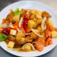 Home Style Sweet and Sour Chicken  · Deep fried chicken breast meat with bell  pepper, tomato, pineapple and onions in a home sty...