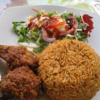 Jollof Rice Lunch  · Served with chicken or fish and salad.