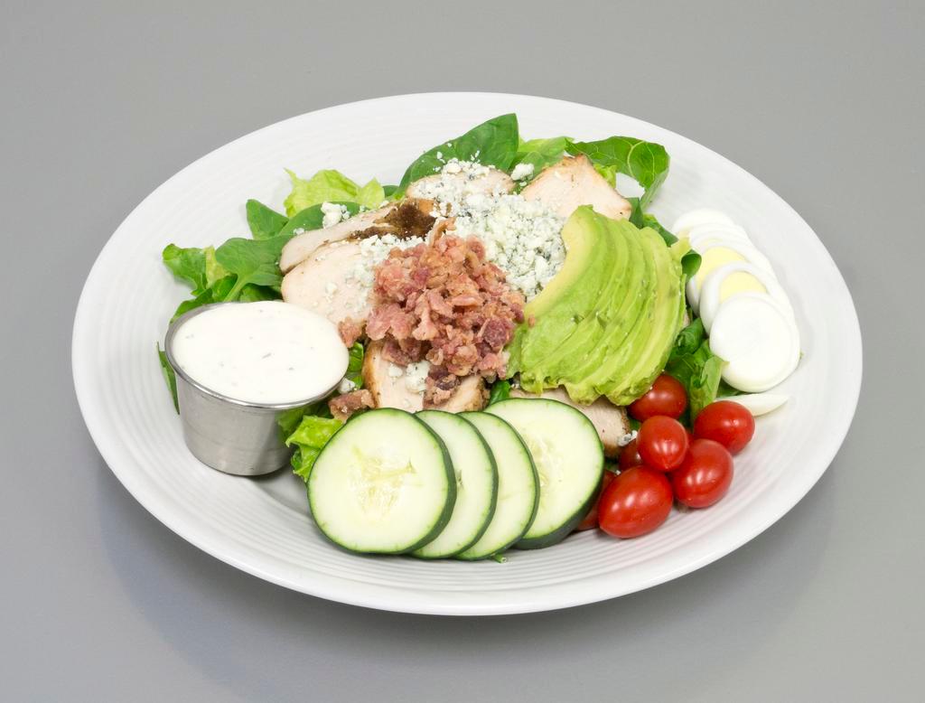 Cobb Salad · Grilled chicken, bacon, hard boiled egg, avocado, blue cheese, tomato and cucumber.