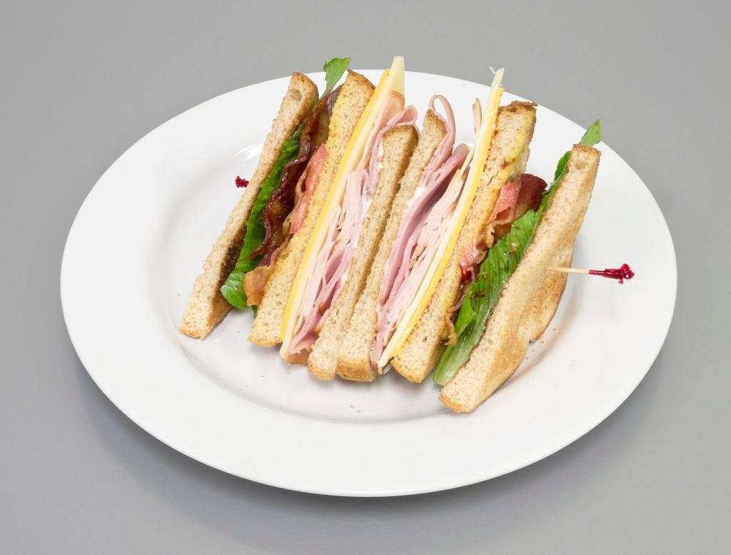 Blue Tower Club Sandwich · Ham, turkey, bacon, Swiss and cheddar cheese, lettuce, tomatoes, honey mustard and mayo on 3 slices of wheat toast.