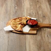 Create Your Own Calzone · Our signature dough filled with up to four toppings of your choice and mozzarella, Parmesan ...
