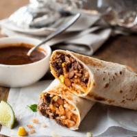 Lamb Burrito · grilled Lamb & Beef ,tortilla bread , rice ,tomatoes, onion,green papper
white sauce & hot s...