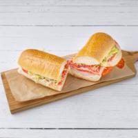 Italian Combo Sandwich · Ham, Genoa salami, pepperoni, provolone cheese, lettuce, onions and Italian dressing on a he...