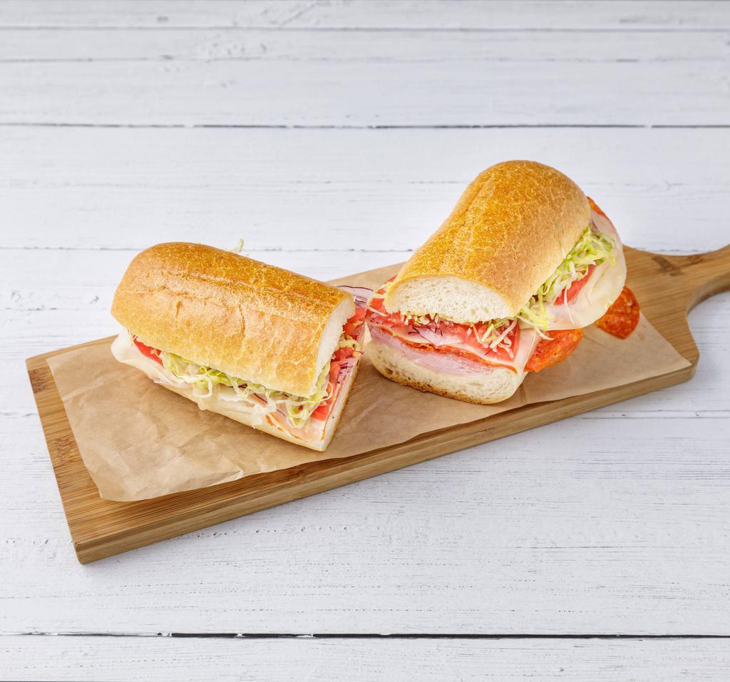Italian Combo Sandwich · Ham, Genoa salami, pepperoni, provolone cheese, lettuce, onions and Italian dressing on a hero bread. 