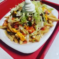 Loaded Fries  · Refried beans, lettuce, tomatoes, cheddar cheese, suizo cheese, guacamole, and sour cream