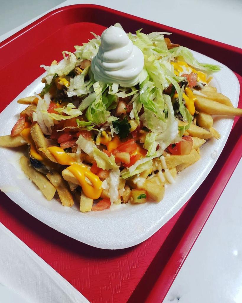 Loaded Fries  · Refried beans, lettuce, tomatoes, cheddar cheese, suizo cheese, guacamole, and sour cream
