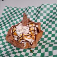Crusto Cream  · Flour Tortilla bowl with 3 scoops of ice cream covered in Nutella, caramel and whipped cream 