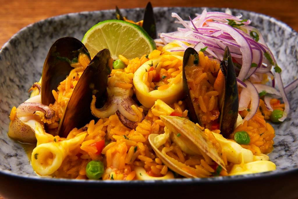 Arroz con Mariscos · Peruvian style seafood paella and salsa criolla.