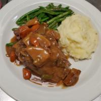 Southern Pot Roast · Slow roasted with carrots and potatoes, topped with savory beef gravy.