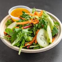 Green Salad · Mixed greens, cucumber, carrots and scallion in ginger dressing.