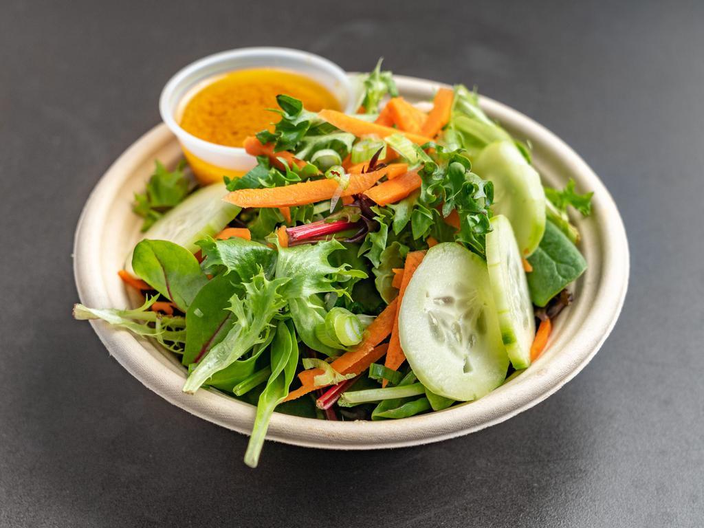 Green Salad · Mixed greens, cucumber, carrots and scallion in ginger dressing.
