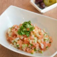 Israeli Salad · Cucumber, tomatoes, onions, tahini.