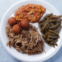Beef Brisket Plate · Served with a bun or 2 hushpuppies, 2 sides and sauce on the side.