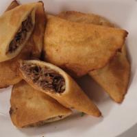 Empanada de carne machada  · Corn with shredded meat 