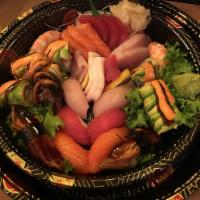 Sushi Sashimi Combo for Two Entree · 10 pieces of sushi, 15 pieces of sashimi and special roll. Served with miso soup or salad.