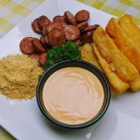 Fried Yucca and Sausage · Fried yucca root served with Kielbasa sausage, farofa and your choice of dip sauce.