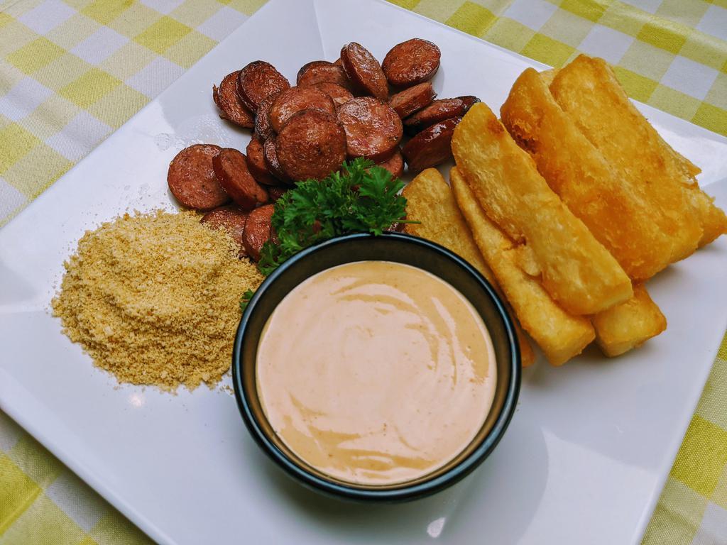 Fried Yucca and Sausage · Fried yucca root served with Kielbasa sausage, farofa and your choice of dip sauce.